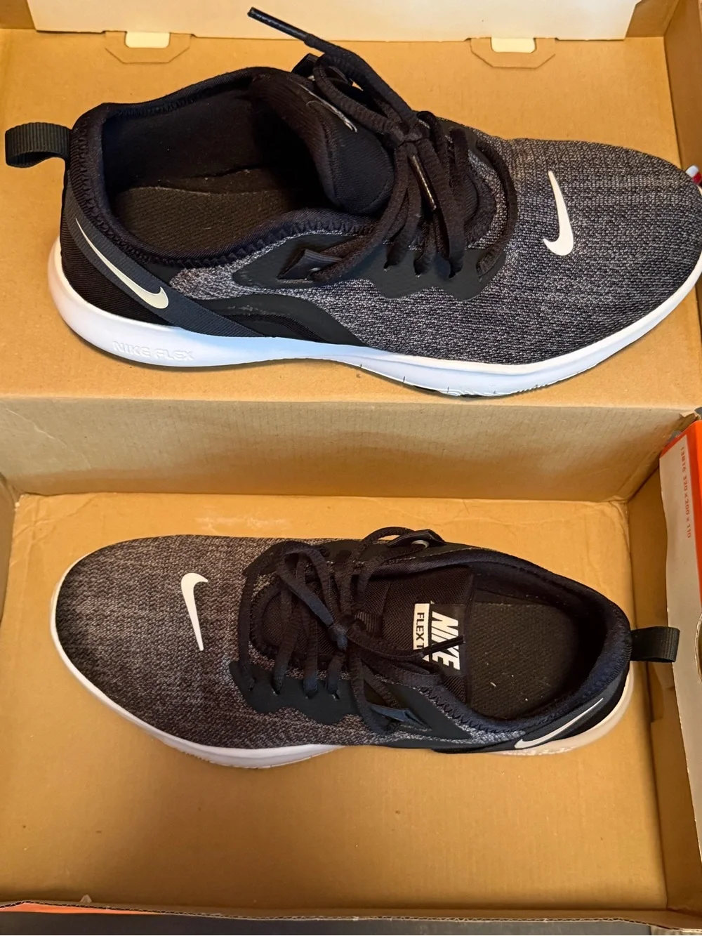 Nike women’s Black and White Knit Training Sneakers